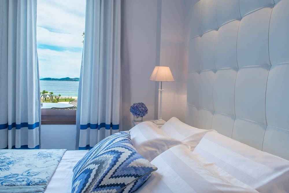 Avaton Luxury Villas Resort - Relais _ Chateaux deluxe room with sea view 1.jpg
