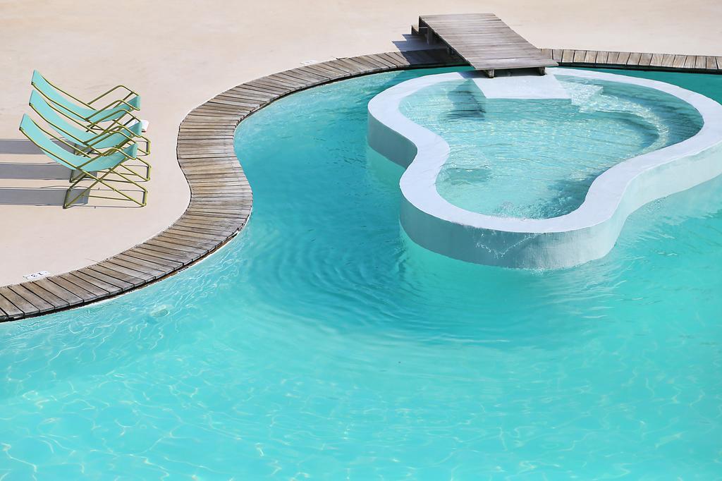 Hotel Ekies All Senses Resort pool and jacuzzi.jpg