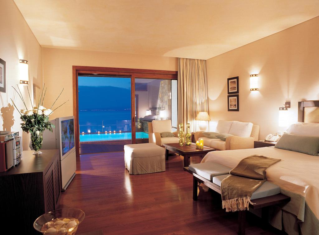 Hotel Grand Resort Lagonissi residential cabanas with pool.jpg
