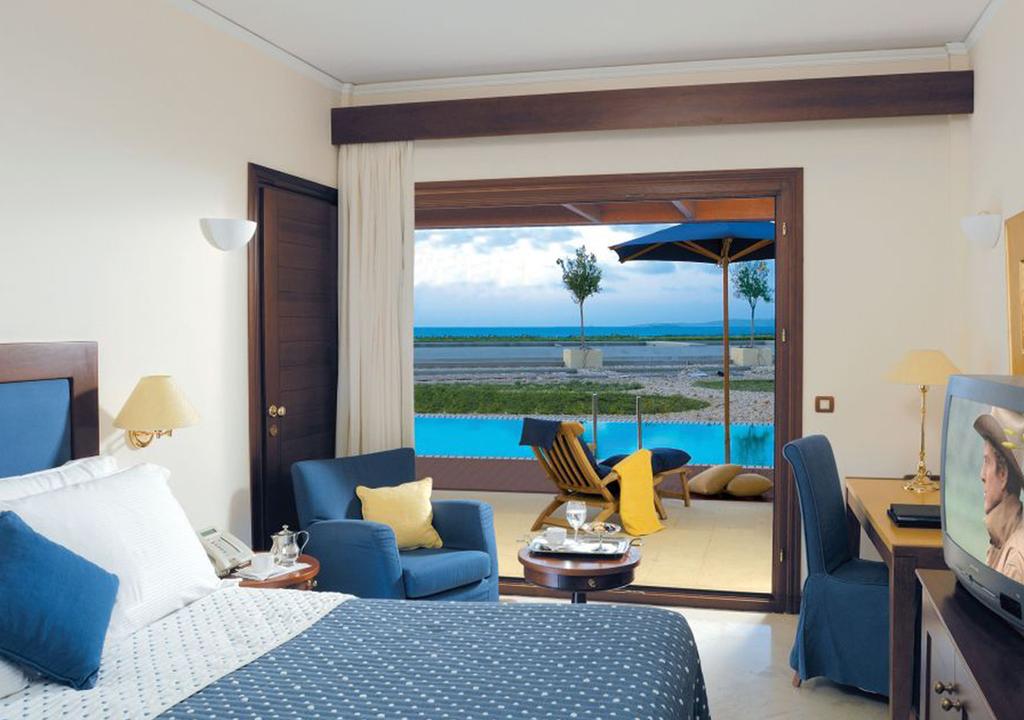 Hotel Grand Resort Lagonissi sunset superior room sharing pool.jpg