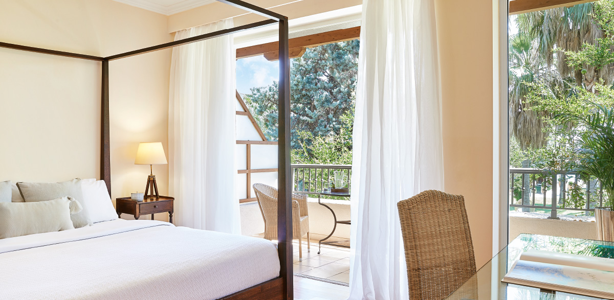 Hotel Grecotel Filoxenia Deluxe guestroom side sea view.jpg