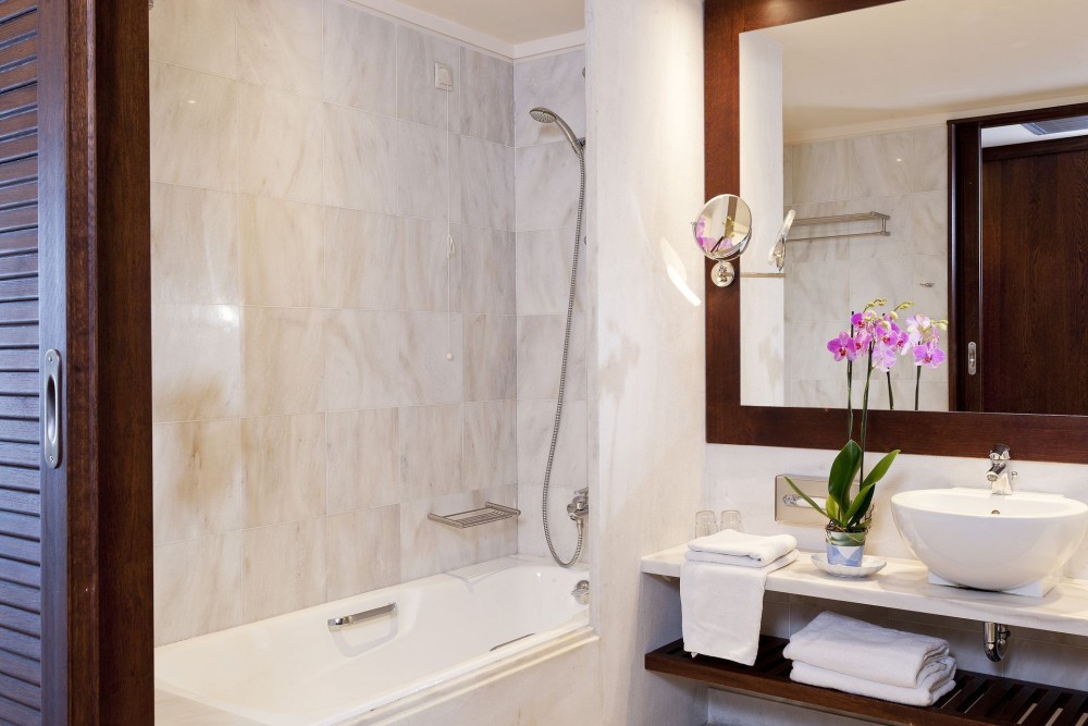 Kontokali Bay Resort _ Spa Hotel Deluxe Suite One Bedroom SV Main Building bathroom.jpeg