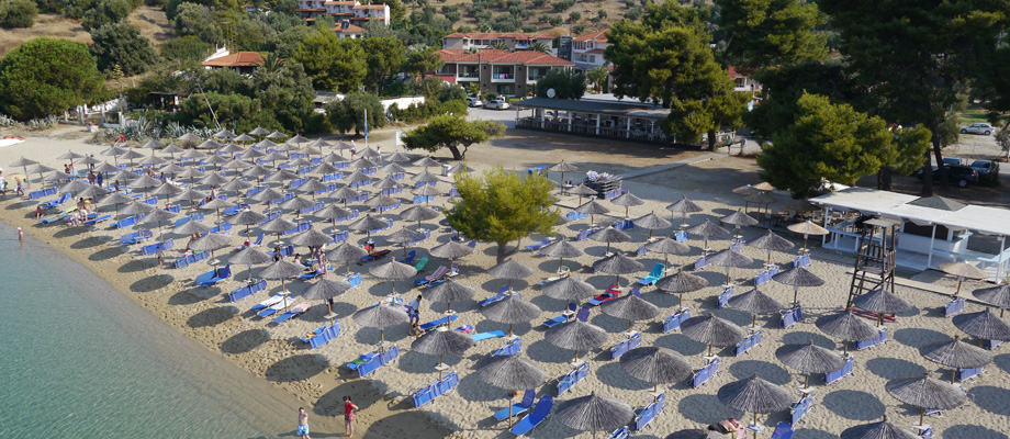 Lagomandra Beach _ Suites Hotel Beach and sunumbrellas.jpg