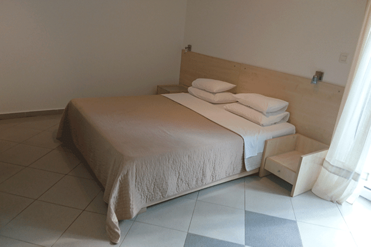 Springs apartmani Bež apartman spavaća soba.jpg
