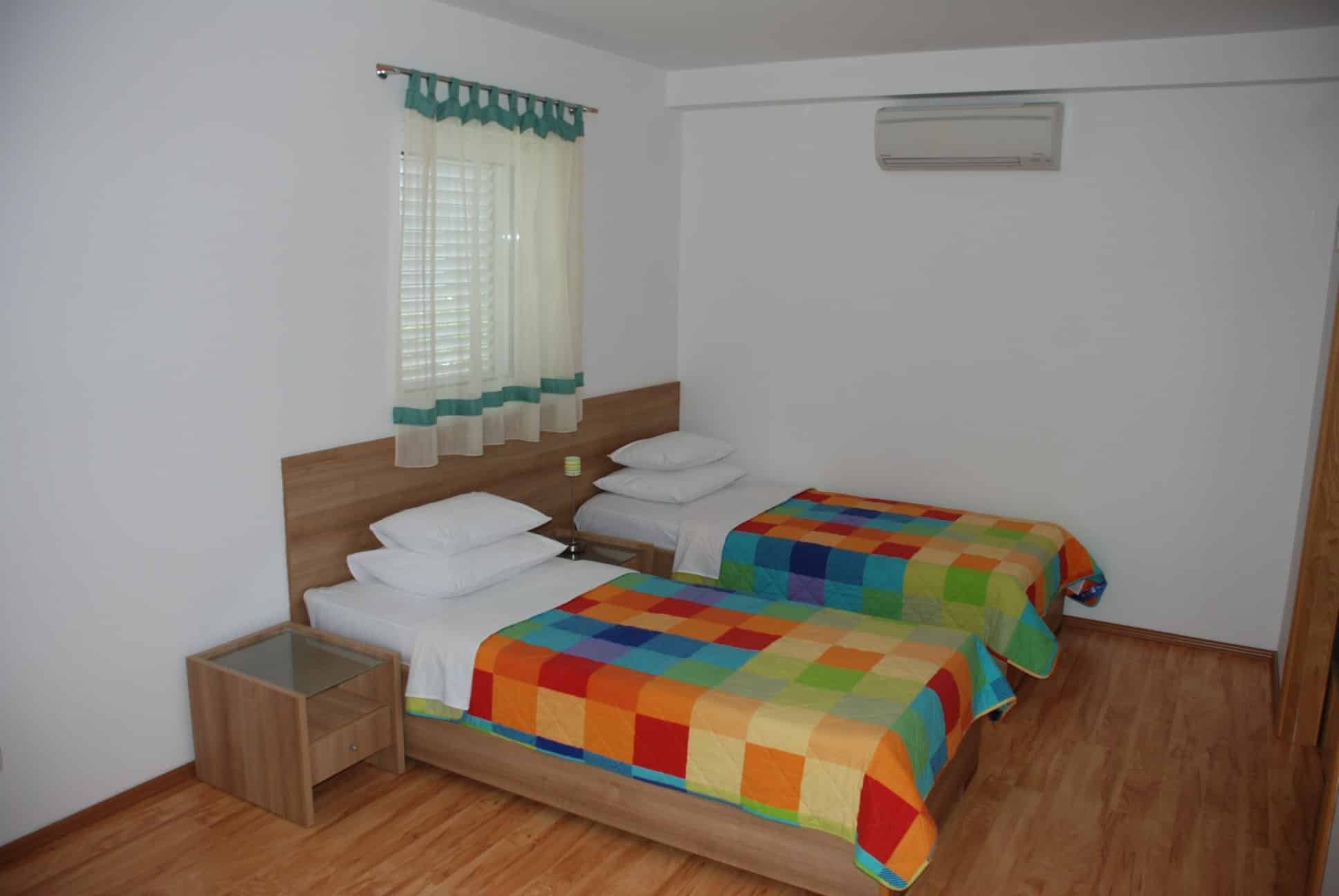 Springs apartmani Zeleni apartman spavaća soba.jpg