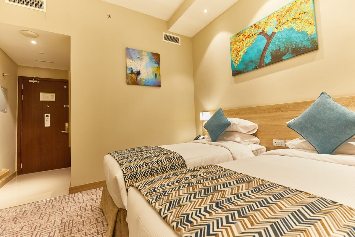 Rose Plaza Hotel Al Basrha-Classic connecting soba.jpg