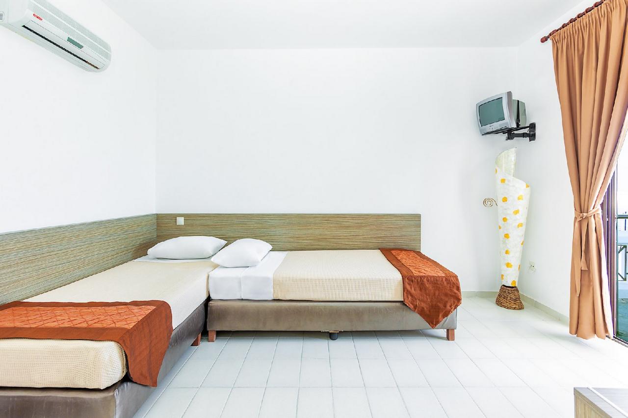 Hotel Xenios Dolphin Beach family room one bedroom 1.jpg